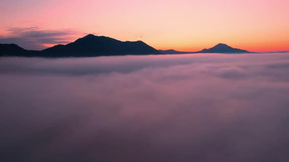 4K Drone Flying through the clouds at dusk or dawn. Aerial top cloudscape