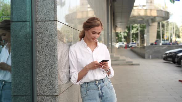 Businesswoman Standing Outdoor Leaning Shoulder On Wall Corporate Building