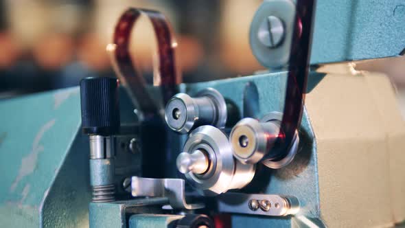 Spinning Reels of the Functioning Film Projector in a Close Up