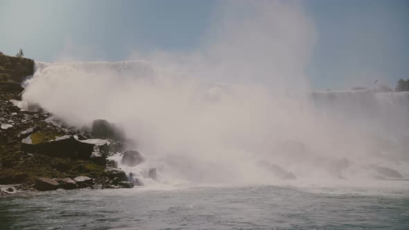 Scenic Slow Motion Cinematic Shot, Birds Flying By Amazing Niagara Falls Waterfall, a Famous Nature