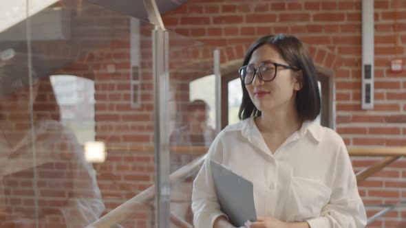 Attractive Asian Businesswoman at Work