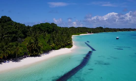 Aerial scenery of island beach break by blue lagoon with sand background