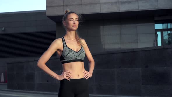 Woman Runner Standing Before Exercising Urban City Background 