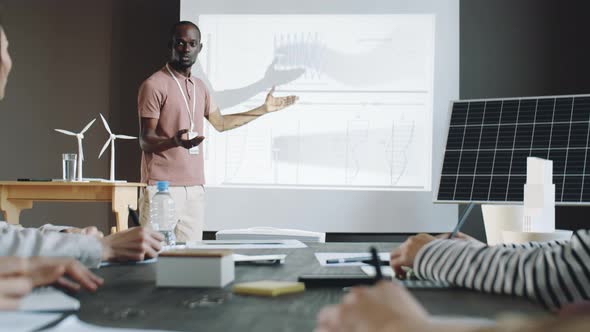 African American Man Giving Presentation about Renewable Energy