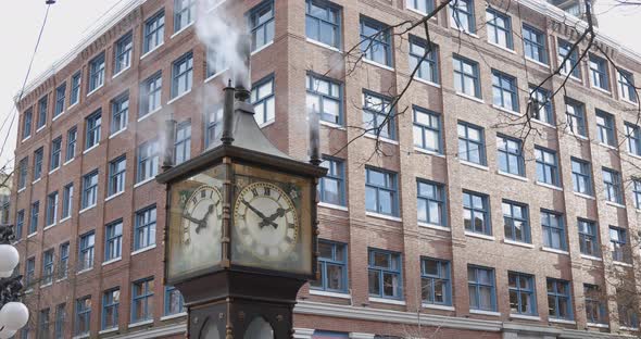 Steam clock in Gastown blowing steam medium shot