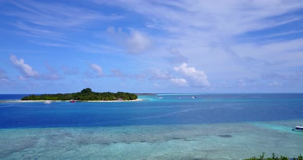 Daytime aerial abstract shot of a white sandy paradise beach and aqua turquoise water background in 