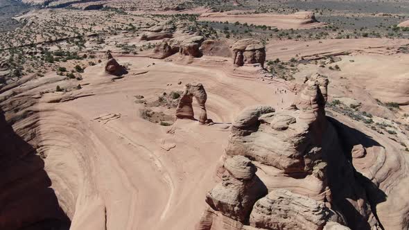 Massive Rocks and Cliffs of Grand Canyon with Tourists Walking Around USA