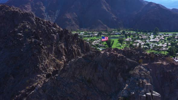 Patriot american flag waving on mountain at Indio California