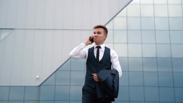 Young Man in Suit Full of Happiness Enjoying Great News About His Business Deal Outdoor