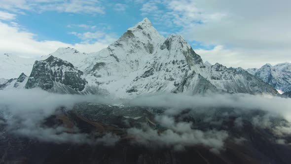 Man on Summit of Nangartsang Looking on Ama Dablam Mountain. Himalaya, Nepal. Aerial View