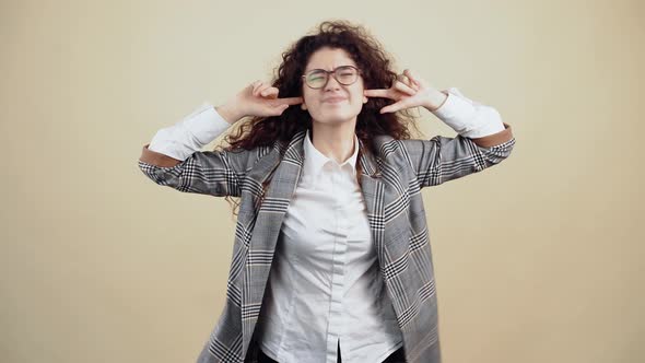 The Desperate Young Woman with Her Fingers in Her Ear Bothered By the Loud Noise