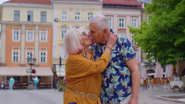 Senior Old Stylish Tourists Man Woman Grandmother Grandfather Family Having a Walk in Summer City