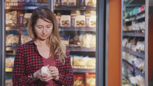 Adult Woman Buying Quality Products in the Hypermarket