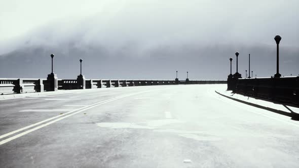 Illuminated Empty Road Bridge in a Fog