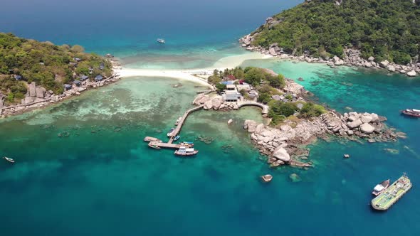 Boats and Pier Near Small Islands. Motor Dive Boats Floating on Calm Blue Sea Near Unique Small