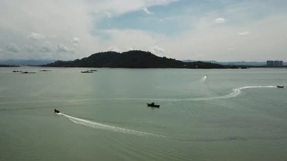 Aerial boats move near Pulau Aman with Batu Kawan