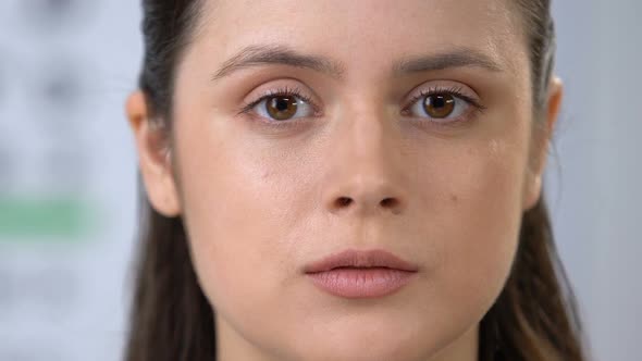 Smiling Female Looking Through Magnifying Glass, Eyes Health Examination