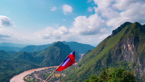Nong Khiaw from the Pha Daeng mountain top national flag, dramatic sky, Laos
