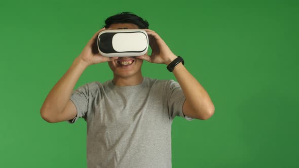 Man Using VR Goggles Device For Mobiles