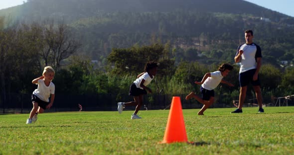 Children running in park during race