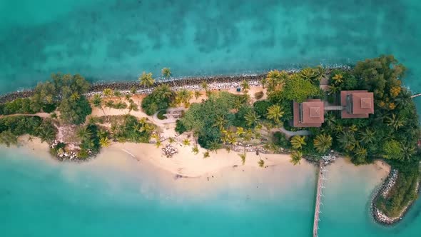 A aerial drone shot of the suspension bridge and Palawan Island on the Santosa Island in Singapur.