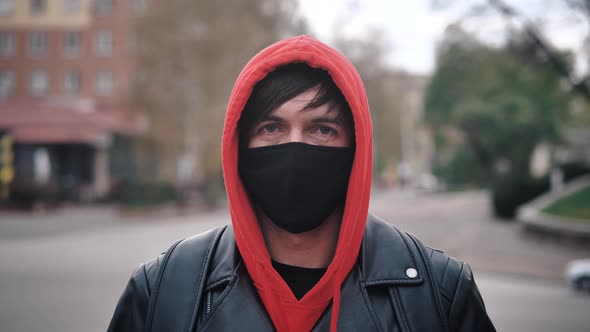 Portrait of Young Man in Protective Mask Standing Outdoors Seasonal Flu Epidemic in Country
