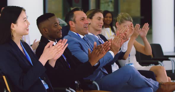 Business people applauding in a business seminar 4k