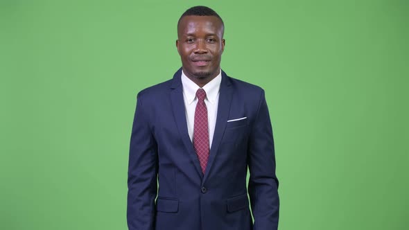 Young Happy African Businessman Smiling