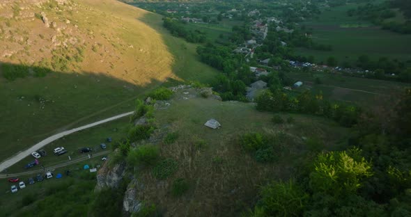 aerial view on tent camping with a tent on top of a cliff