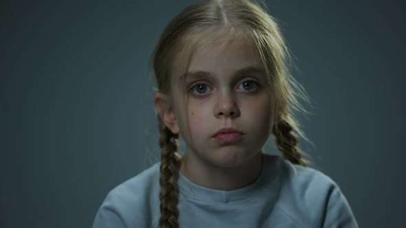 Upset Girl Looking Into Camera, Piercing Glance, Child Hoping for Happiness