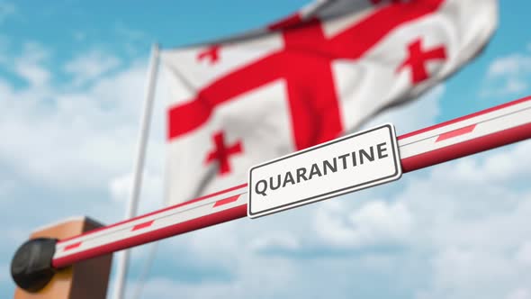 Opening Barrier with QUARANTINE Sign at the Georgian Flag