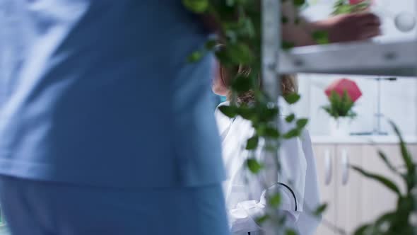 Chemist in Research Center Studying Some Liquid Samples alt