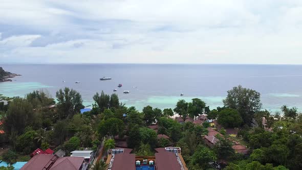 Aerial Drone View of Resort on Tropical Island with Blue Ocean in Thailand