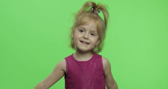 Girl Holds Chamomile Flower and Sniffs. Happy Four Years Old Girl. Chroma Key