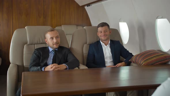 Luxury Life of Businesspeople Discussing Inside Business Private Jet