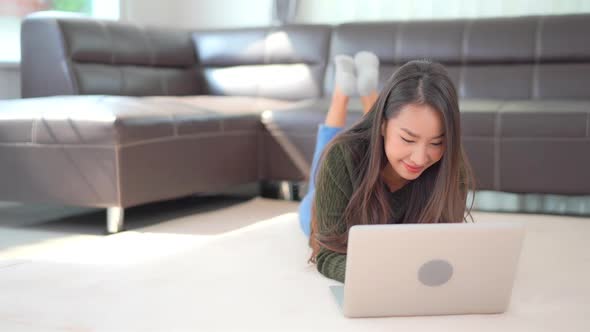 Young asian woman use laptop