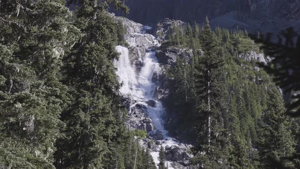 Waterfall Cascading Down a Rocky Mountain Cliff in Canadian Nature Landscape