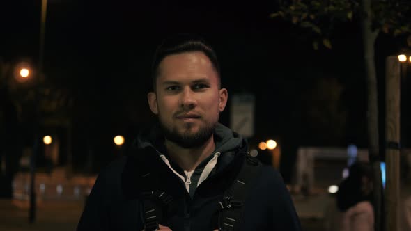 Portrait of a Successful Young Tourist Man Student Officer Manager After Work a Public Place Looks