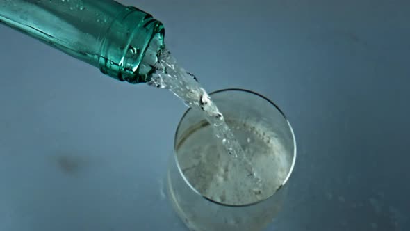 Transparent Bottle Pouring Wine Closeup