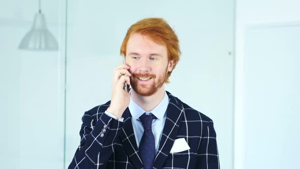 Man Talking on Smartphone, Sitting in Office