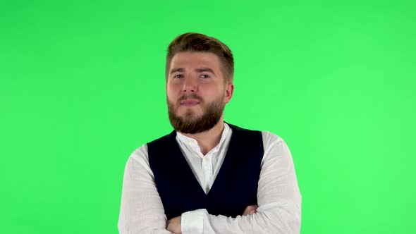 Man Listens Carefully To Boring Information and Looks Around on Green Screen