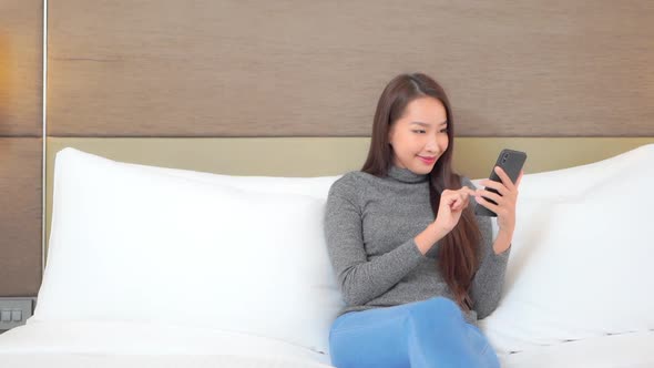 Young asian woman use smart phone