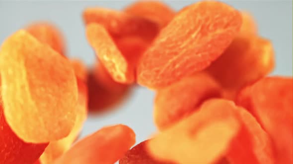 Dried Apricots Soar Against a Blue Background