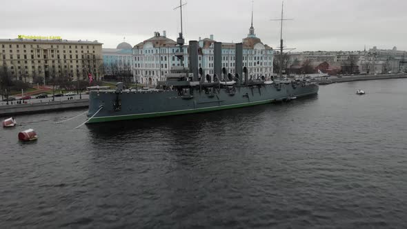 Flight on the Drone Above the Neva the Cruiser Aurora and the Center of St