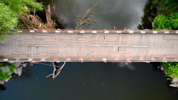 Drone Shot of Old Emergency Bridge Over Small River, Dangerous
