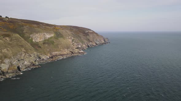 Scenic View Of Howth Head Surrounded By Irish Sea In Ireland. aerial drone, wide shot