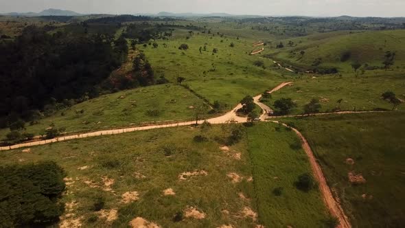 Aerial flying over a dry arid barren landscape on a hot day in the rural countryside during a draugh