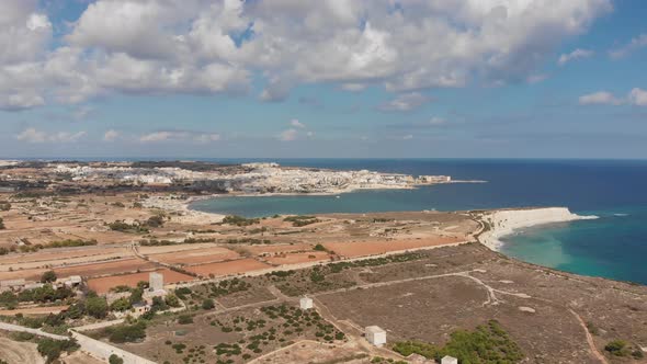 Aerial drone video from eastern Malta, Marsaxlokk area, Il-Hofra l-Kbira bay.