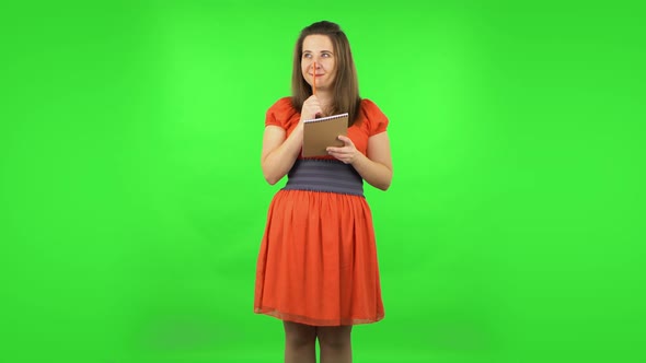 Cute Girl Is Thinking, Then Happy Writing with Pencil in Notebook