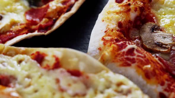 Various pizza on table